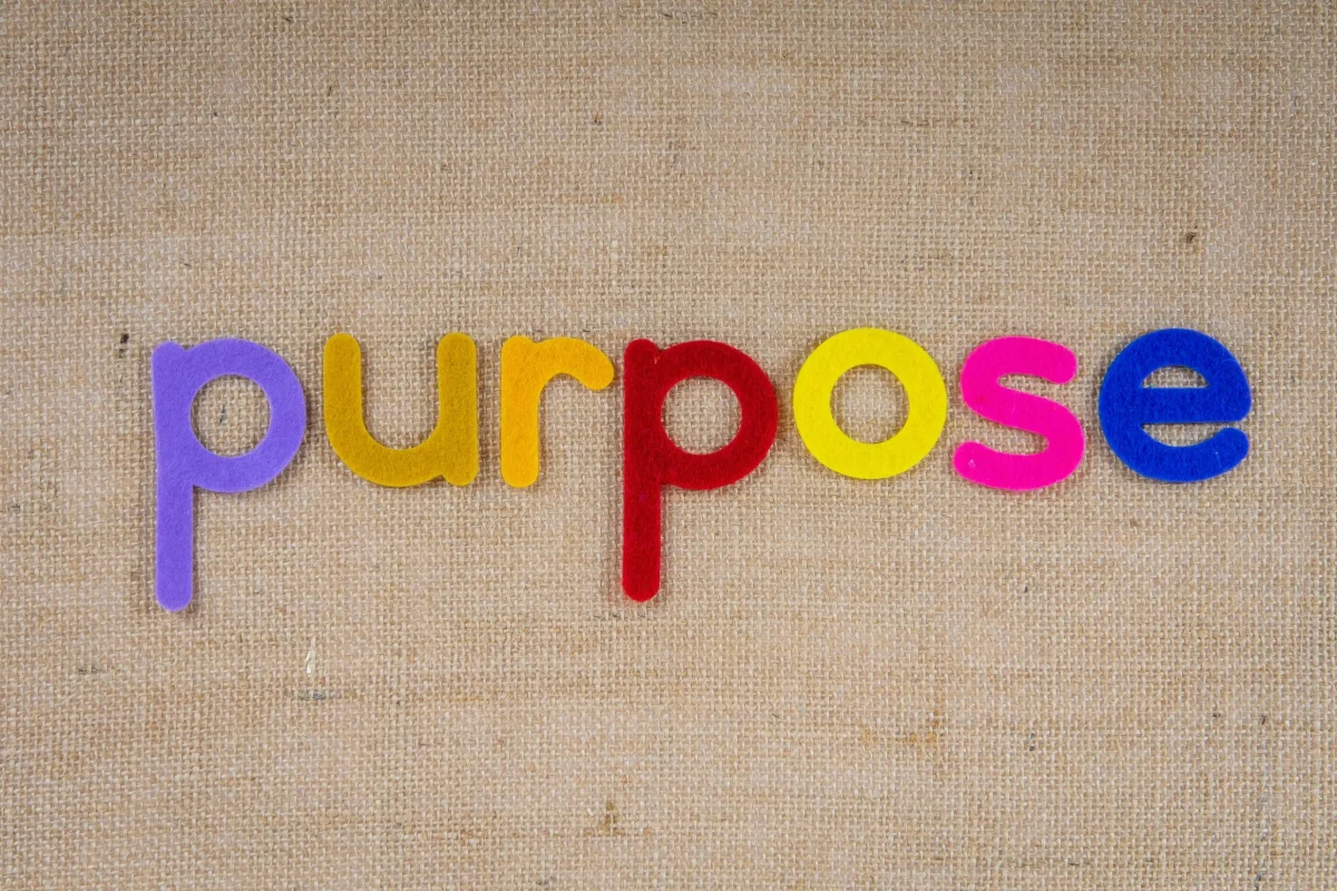 The word purpose spelled out in colorful felt letters, illustrating the question what is my purpose