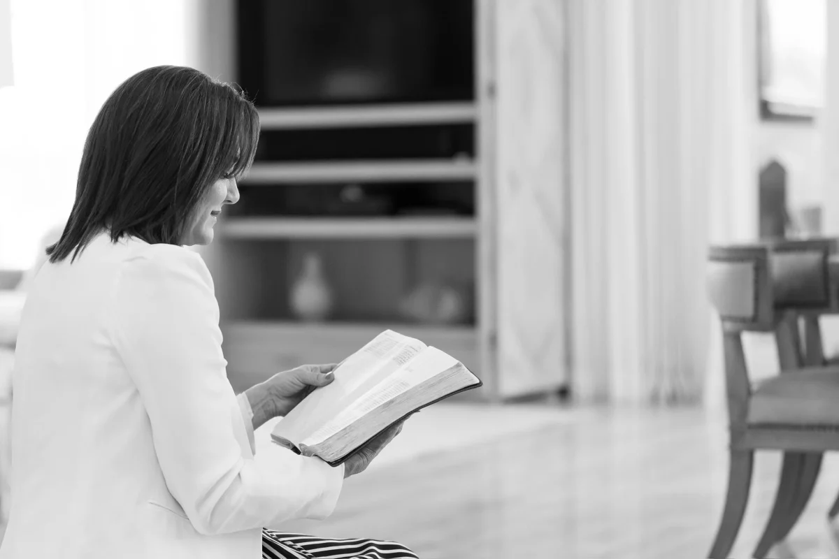 Chantell Cooley reading an open Bible in a quiet room, the daily habit of sitting with Jesus